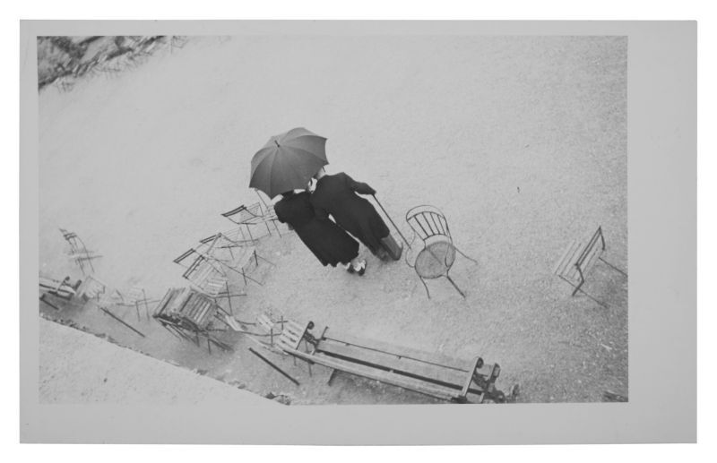 Parc des Tuilleries (Couple With Umbrella) Lot Sold  6,985 USD, Альбом: «On the Road» by Robert Frank from the Collection of Arthur S. Penn